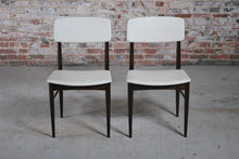 Load image into Gallery viewer, A pair of Mid Century dining chairs with original white vinyl upholstery, circa 1960s.

