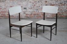 Load image into Gallery viewer, A pair of Mid Century dining chairs with original white vinyl upholstery, circa 1960s.
