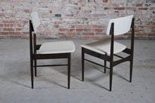 Load image into Gallery viewer, A pair of Mid Century dining chairs with original white vinyl upholstery, circa 1960s.
