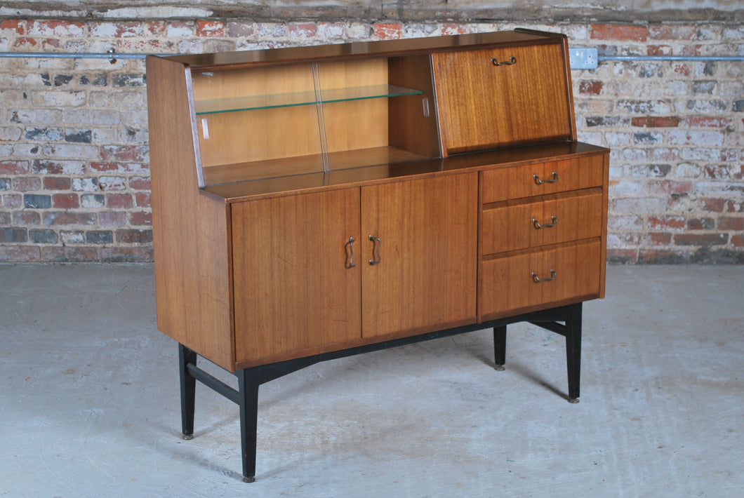British Mid Century Nathan drinks cabinet in tola and black, circa 1950s.