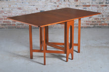 Load image into Gallery viewer, Mid Century rectangular drop leaf teak dining tabe, circa 1960s.

