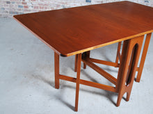 Load image into Gallery viewer, Mid Century rectangular drop leaf teak dining tabe, circa 1960s.
