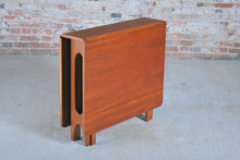 Load image into Gallery viewer, Mid Century rectangular drop leaf teak dining tabe, circa 1960s.
