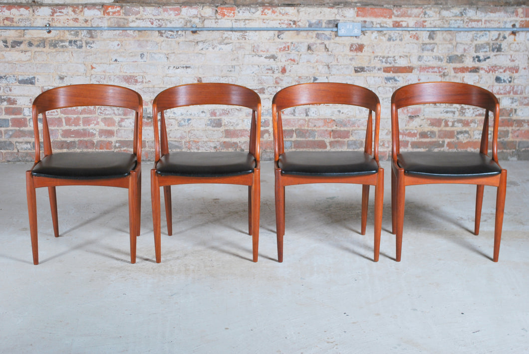 Set of 4 Danish Mid Century Model 16 teak dining chairs with original black vinyl upholstery by Johannes Andersen for Uldum Mobelfabrik, circa 1960s.