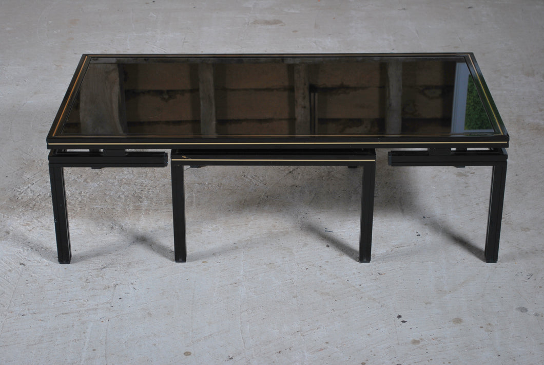 Mid Century aluminium and black tinted glass coffee table with nesting side table by Pierre Vandel, Paris, France. Circa 1970s