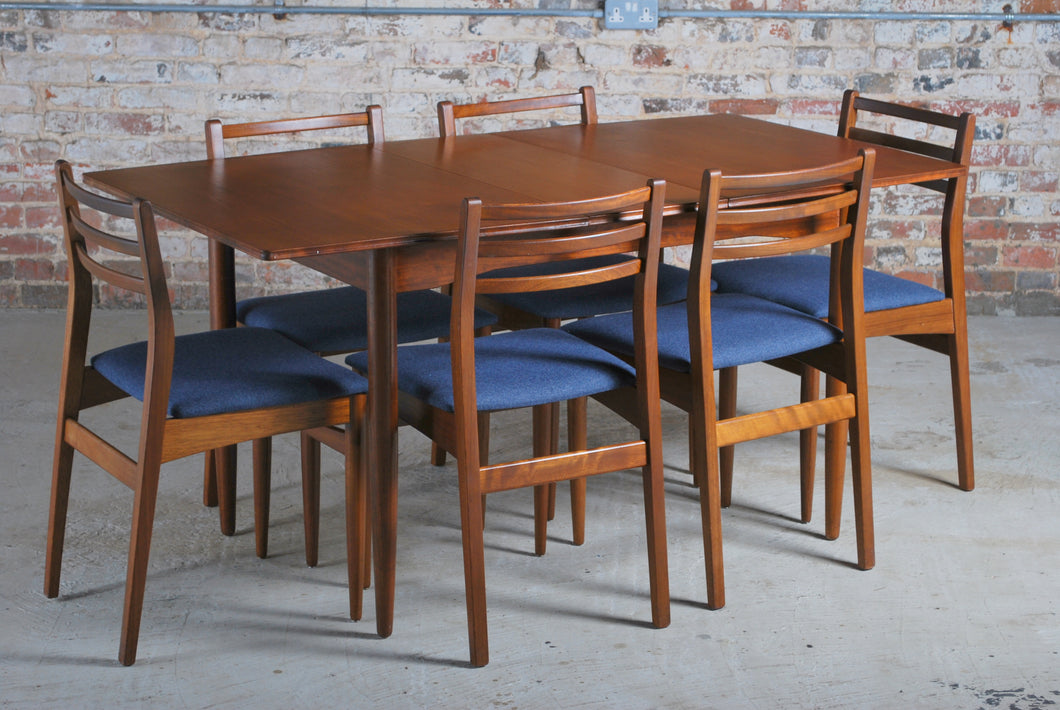 Mid Century extending teak dining table and 6 chairs, circa 1960s.