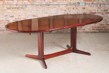 Load image into Gallery viewer, Danish Mid Century oval rosewood dining table, circa 1970s. 2 Extension leaves stored underneath, seats up to 12 people.
