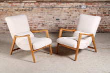 Load image into Gallery viewer, A pair of Mid Century G-plan Siesta armchairs reupholstered in white boucle fabric, circa 1950s.
