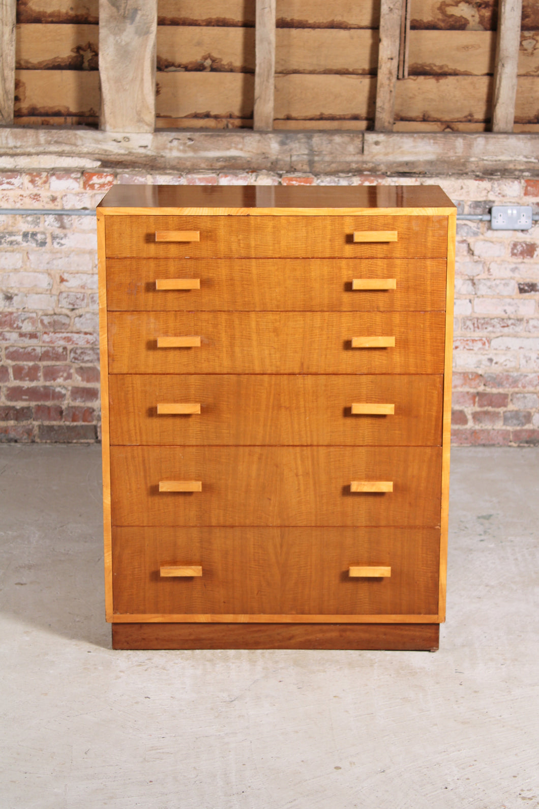 Mid Century walnut chest of 6 drawers by Alfred Cox, England, circa 1960s.