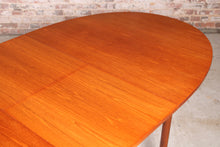 Load image into Gallery viewer, Mid Century extending oval teak dining table by McIntosh, Scotland, circa 1960s.
