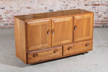 Load image into Gallery viewer, Mid Century Ercol Windsor elm sideboard on casters, c. 1960s
