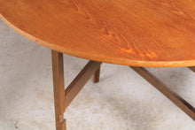 Load image into Gallery viewer, Mid Century oval drop leaf teak dining table.
