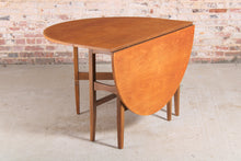 Load image into Gallery viewer, Mid Century oval drop leaf teak dining table.
