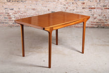 Load image into Gallery viewer, Mid Century extending rectangular teak dining table by McIntosh.
