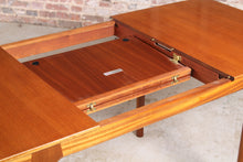 Load image into Gallery viewer, Mid Century extending rectangular teak dining table by McIntosh.

