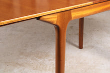Load image into Gallery viewer, Mid Century extending rectangular teak dining table by McIntosh.
