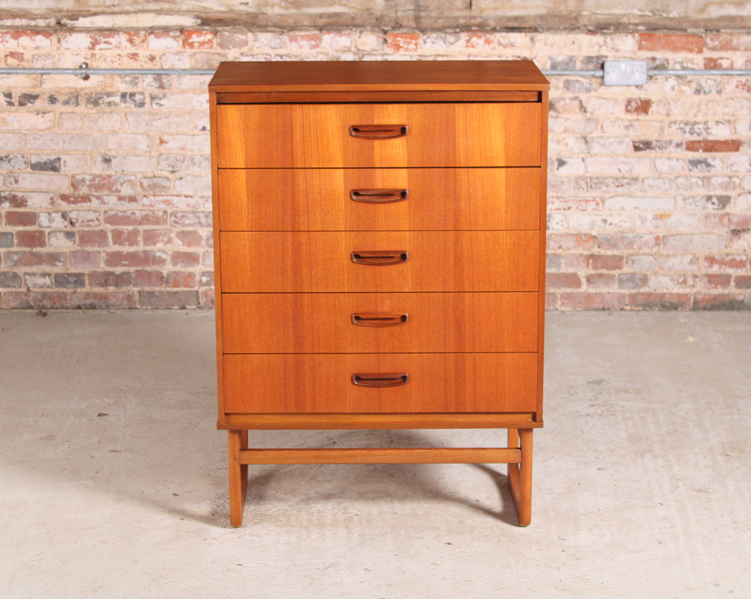 Danish style Mid Century teak chest of 5 drawers with carved teak handles, circa 1960s.