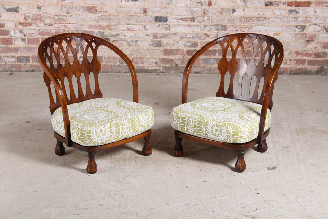 A pair of Arts & Crafts nursing chairs with newly reupholstered cushions, circa 1930s.