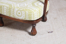 Load image into Gallery viewer, A pair of Arts &amp; Crafts nursing chairs with newly reupholstered cushions, circa 1930s.
