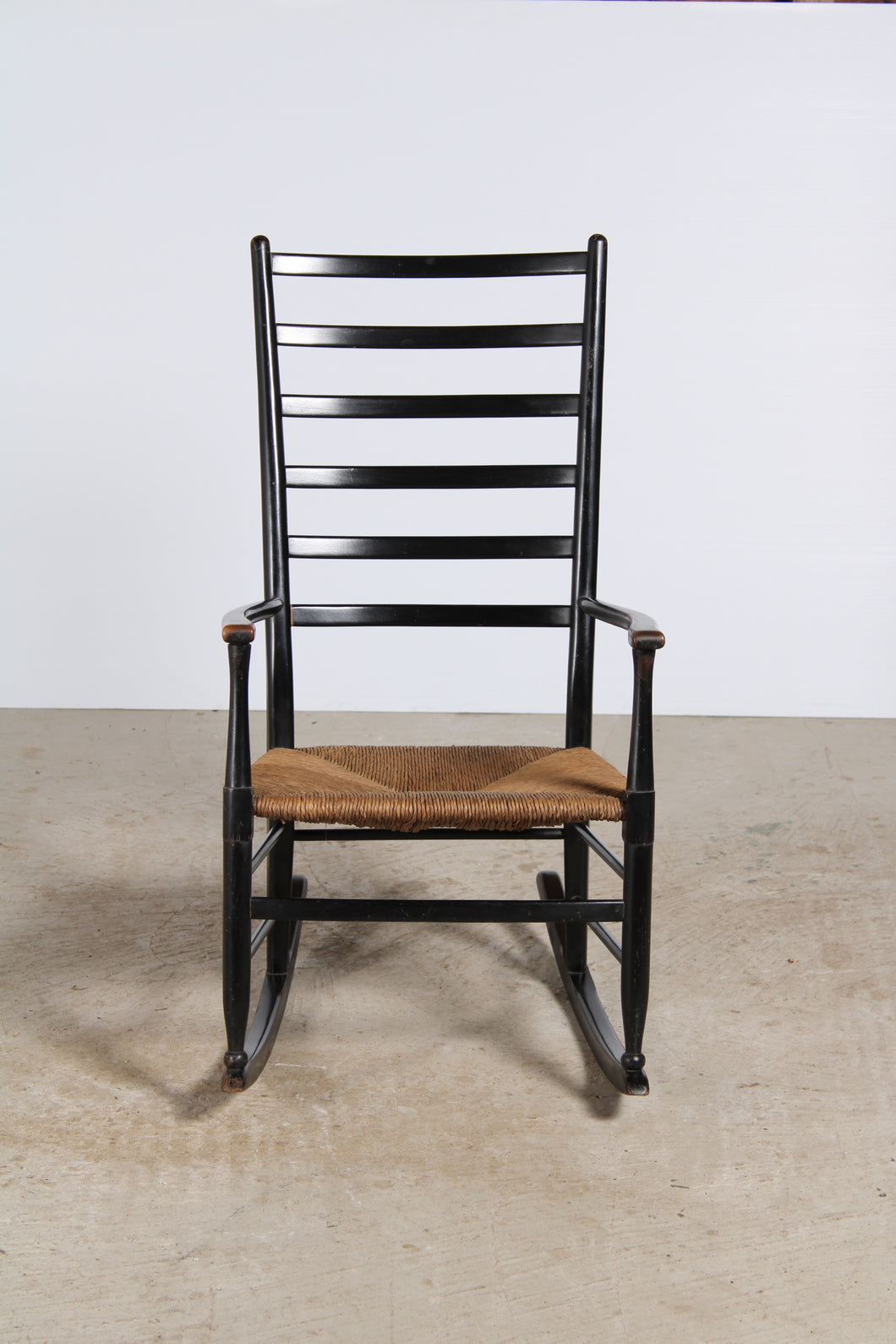 Danish Mid Century ladderback rocking chair.