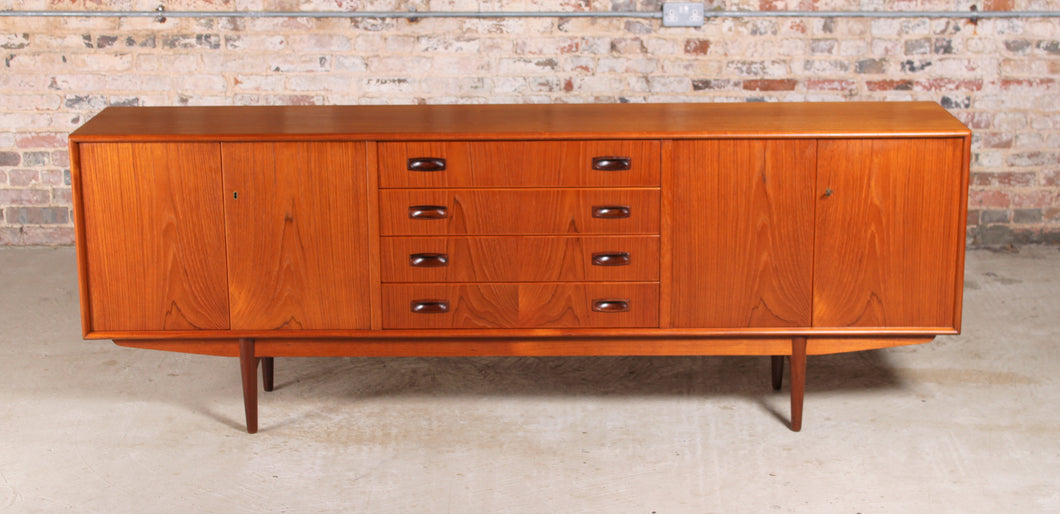 Danish Mid Century teak sideboard with carved rosewood handles.