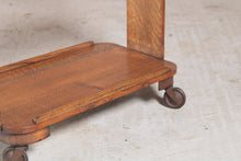 Load image into Gallery viewer, Art Deco style solid oak serving trolley on original brass casters.
