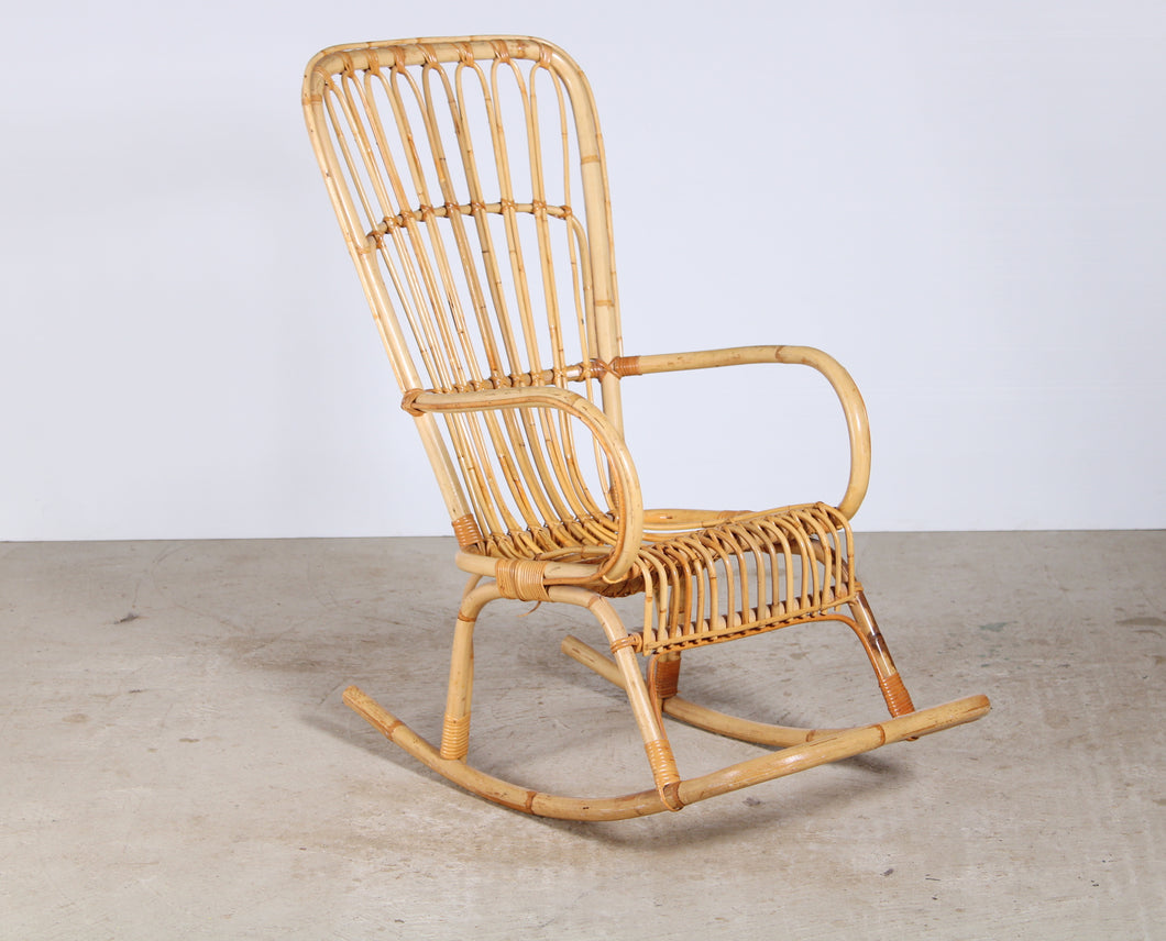 A vintage 1960s boho bamboo rocking chair
