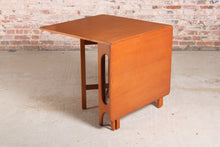 Load image into Gallery viewer, Mid Century drop-leaf teak dining table, circa 1960s.
