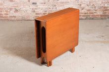 Load image into Gallery viewer, Mid Century drop-leaf teak dining table, circa 1960s.
