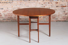 Load image into Gallery viewer, Mid Century drop-leaf teak dining table, circa 1960s.
