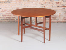 Load image into Gallery viewer, Mid Century drop-leaf teak dining table, circa 1960s.
