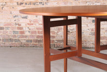 Load image into Gallery viewer, Mid Century drop-leaf teak dining table, circa 1960s.

