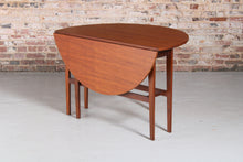 Load image into Gallery viewer, Mid Century drop-leaf teak dining table, circa 1960s.
