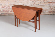 Load image into Gallery viewer, Mid Century drop-leaf teak dining table, circa 1960s.
