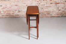 Load image into Gallery viewer, Mid Century drop-leaf teak dining table, circa 1960s.
