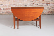 Load image into Gallery viewer, Mid Century drop-leaf teak dining table, circa 1960s.
