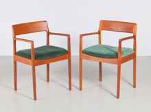 Load image into Gallery viewer, A pair of Danish Mid Century teak carver dining chairs by Johannes Nørgaard for the Nørgaards Møbelfabrik, circa 1960s.
