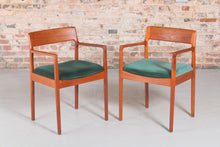 Load image into Gallery viewer, A pair of Danish Mid Century teak carver dining chairs by Johannes Nørgaard for the Nørgaards Møbelfabrik, circa 1960s.
