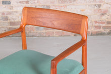 Load image into Gallery viewer, A pair of Danish Mid Century teak carver dining chairs by Johannes Nørgaard for the Nørgaards Møbelfabrik, circa 1960s.
