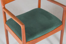Load image into Gallery viewer, A pair of Danish Mid Century teak carver dining chairs by Johannes Nørgaard for the Nørgaards Møbelfabrik, circa 1960s.
