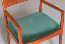 Load image into Gallery viewer, A pair of Danish Mid Century teak carver dining chairs by Johannes Nørgaard for the Nørgaards Møbelfabrik, circa 1960s.
