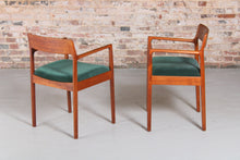 Load image into Gallery viewer, A pair of Danish Mid Century teak carver dining chairs by Johannes Nørgaard for the Nørgaards Møbelfabrik, circa 1960s.
