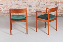 Load image into Gallery viewer, A pair of Danish Mid Century teak carver dining chairs by Johannes Nørgaard for the Nørgaards Møbelfabrik, circa 1960s.
