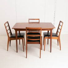 Load image into Gallery viewer, A British Mid Century teak extending dining table and four chairs designed by McIntosh, Scotland circa 1960s.
