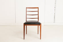 Load image into Gallery viewer, A British Mid Century teak extending dining table and four chairs designed by McIntosh, Scotland circa 1960s.
