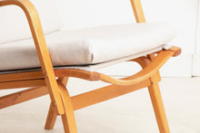 Load image into Gallery viewer, A Finnish mid century armchair designed by Ilmari Lappalainen for Asko, circa 1960s.
