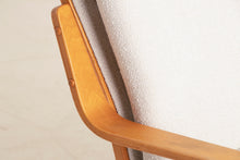 Load image into Gallery viewer, A Finnish mid century armchair designed by Ilmari Lappalainen for Asko, circa 1960s.
