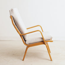 Load image into Gallery viewer, A Finnish mid century armchair designed by Ilmari Lappalainen for Asko, circa 1960s.
