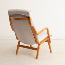 Load image into Gallery viewer, A Finnish mid century armchair designed by Ilmari Lappalainen for Asko, circa 1960s.
