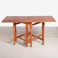 Load image into Gallery viewer, Mid Century drop-leaf teak dining table, circa 1960s.
